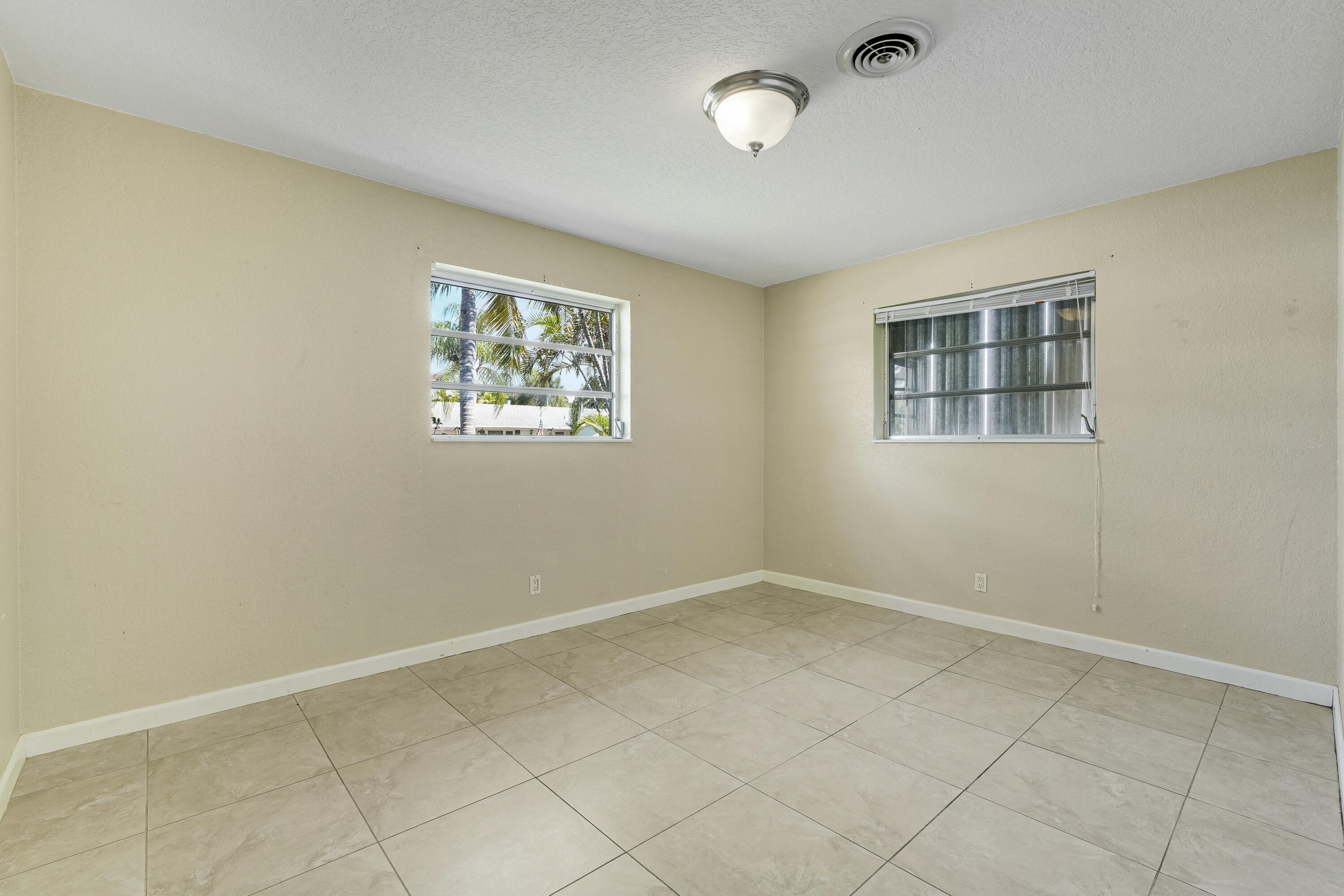 20 Willow Road Tequesta, FL 33469 - Photo 27 of 43 an empty room with windows