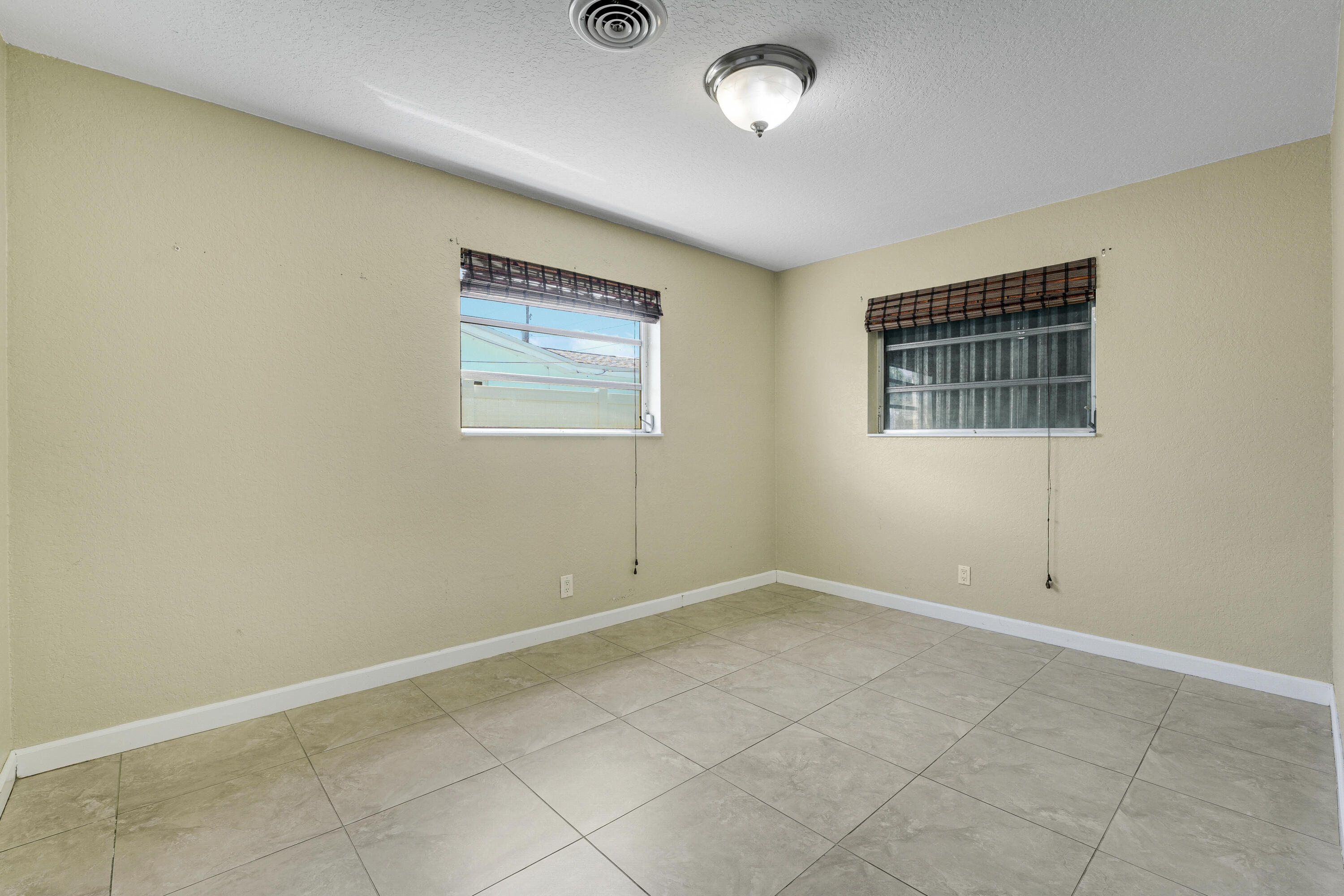 20 Willow Road Tequesta, FL 33469 - Photo 28 of 43 an empty room with windows
