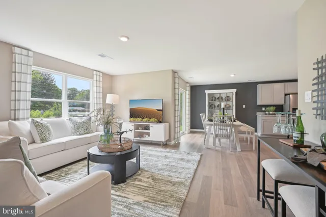 a living room with furniture and a table