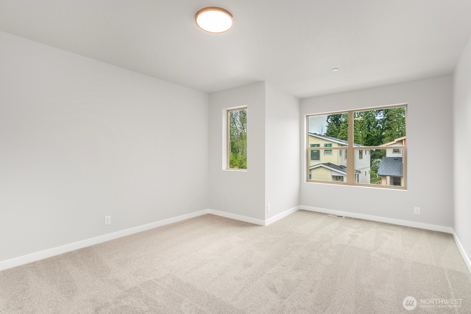 13302 Southeast 238th Place, Unit 7 Kent, WA 98042 - Photo 22 of 37 an empty room with windows