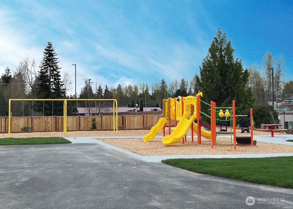 13302 Southeast 238th Place, Unit 7 Kent, WA 98042 - Photo 36 of 37 a view of park with slide