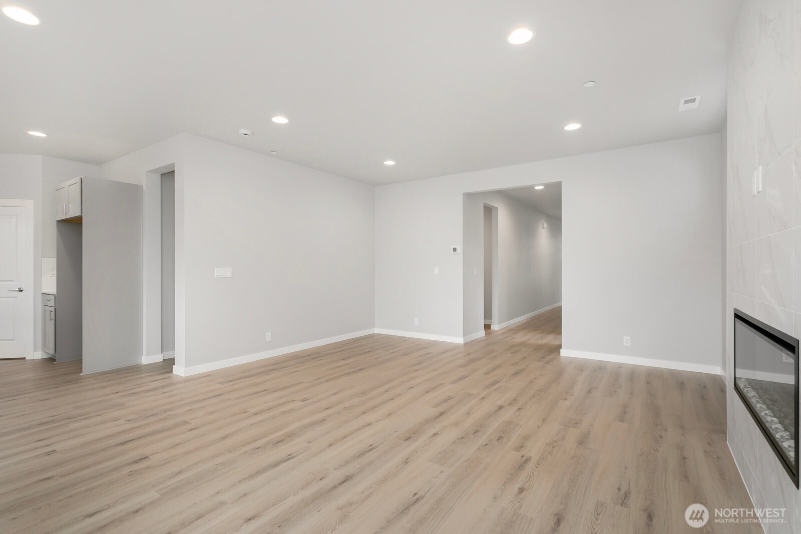 13302 Southeast 238th Place, Unit 7 Kent, WA 98042 - Photo 7 of 37 a view of an empty room with wooden floor