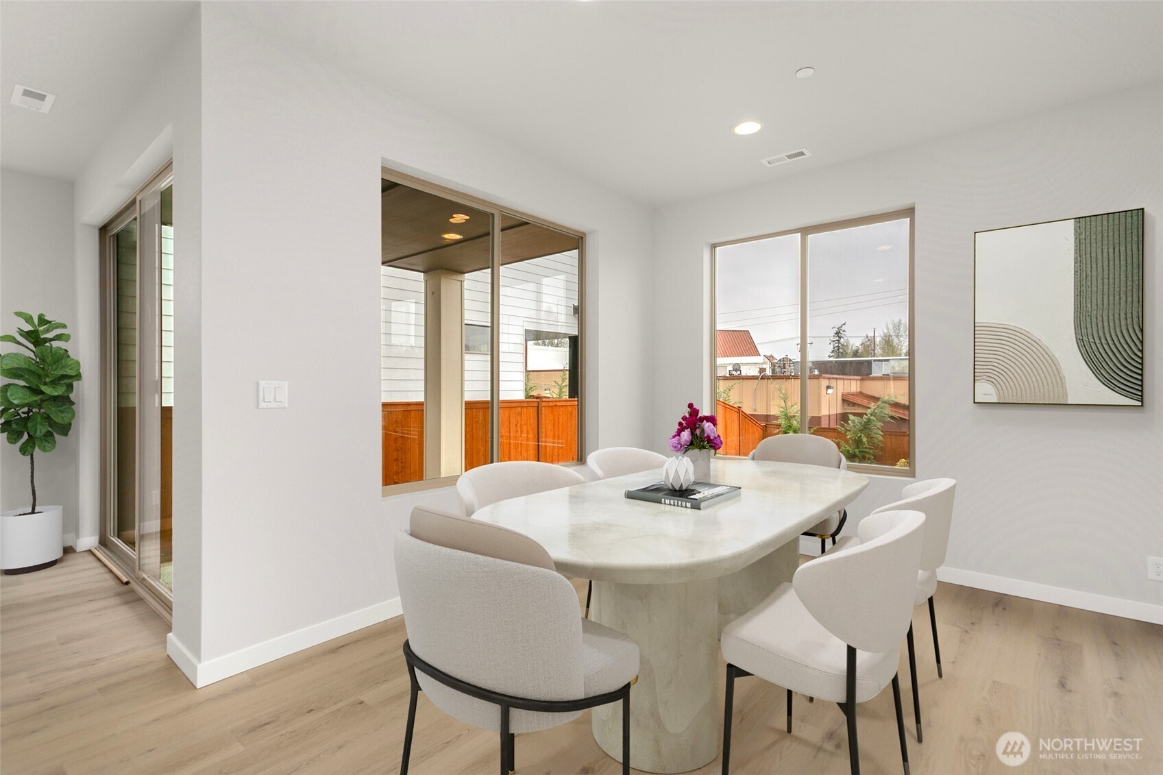 13302 Southeast 238th Place, Unit 7 Kent, WA 98042 - Photo 8 of 37 a view of a dining room with furniture window and wooden floor