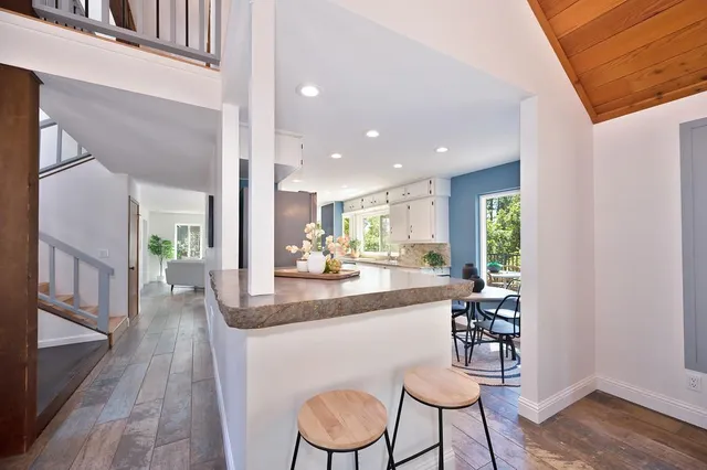 a view of a chairs and table on the deck