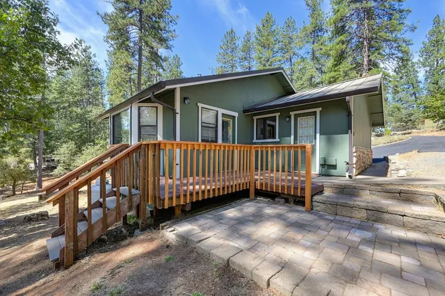 a kitchen with cabinets and chairs