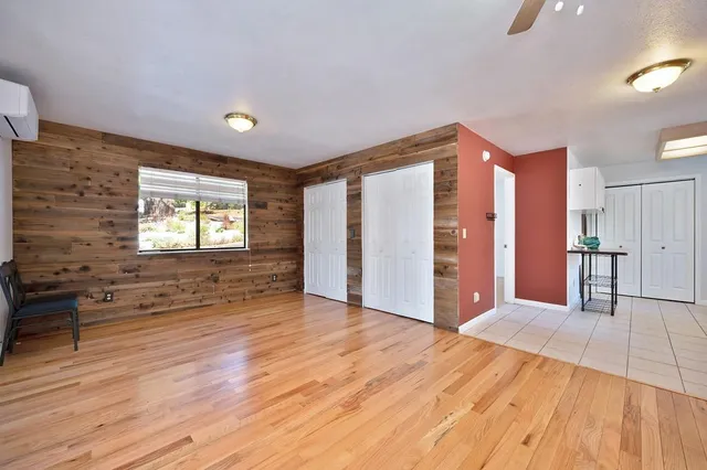 a kitchen with a refrigerator sink and cabinets