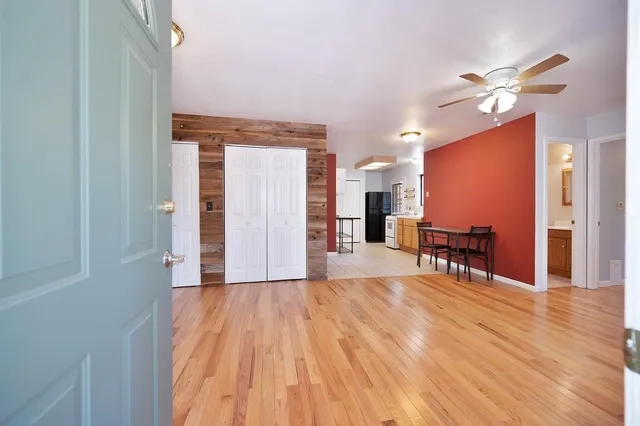 a view of backyard with deck and wooden floor