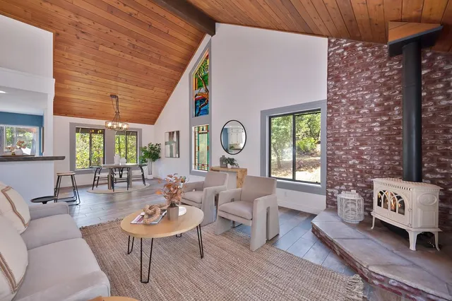 a view of balcony with chairs and wooden floor