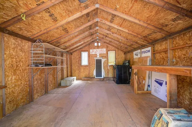 a backyard of a house with trees and houses
