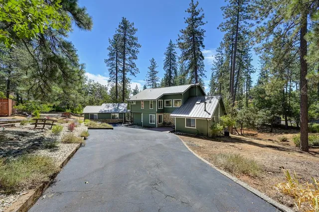 a living room with furniture a window and wooden floor