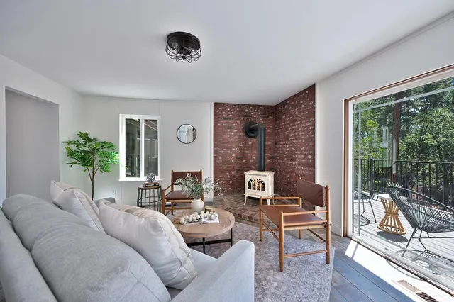 a kitchen with stainless steel appliances white cabinets and wooden floors
