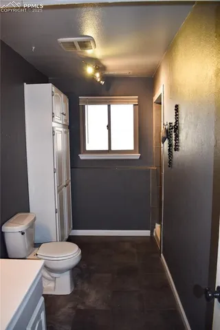a bathroom with a sink and a toilet