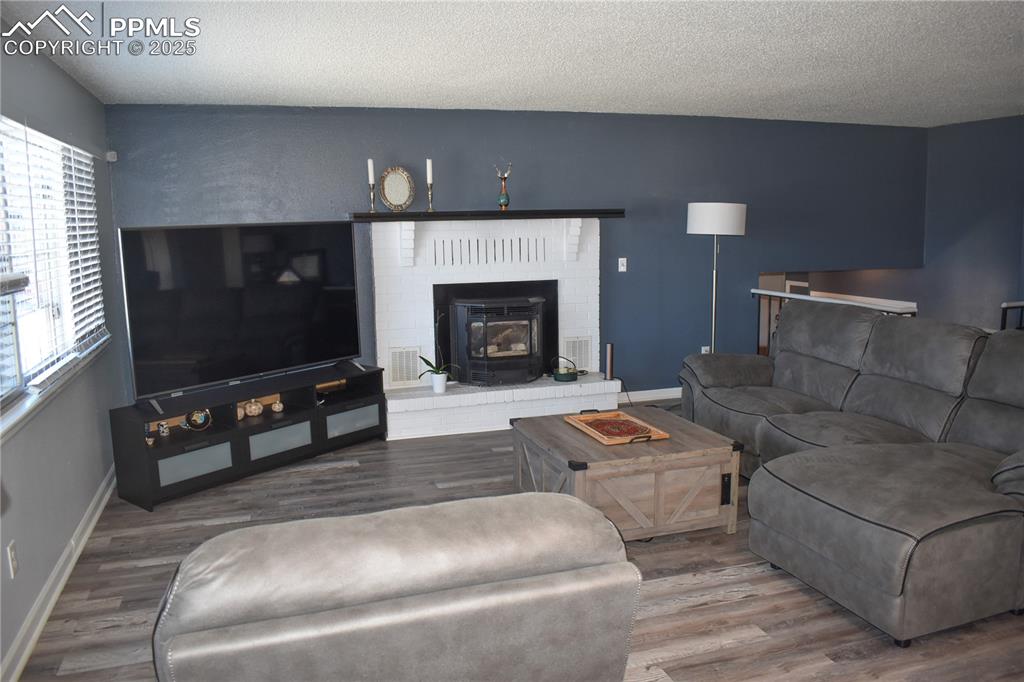 18 Chaparral Circle La Junta, CO 81050 - Photo 5 of 24 a living room with furniture a fireplace and a flat screen tv