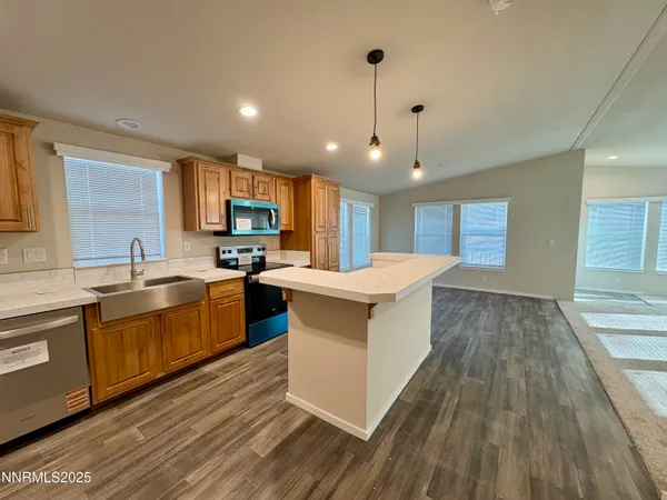 a large kitchen with kitchen island a sink and a stove