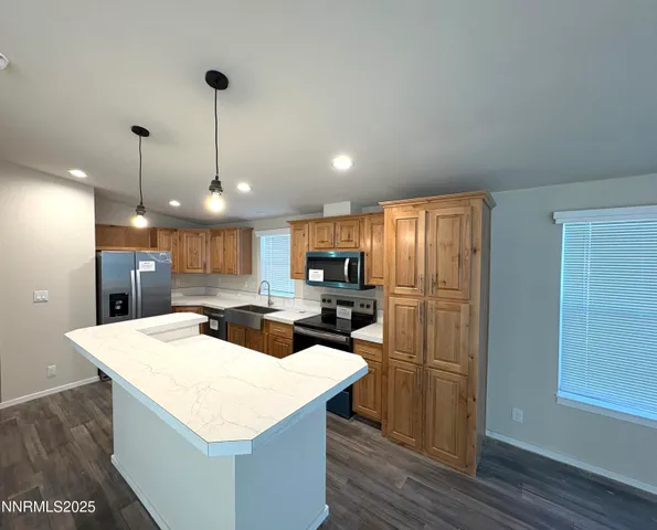 a kitchen with a refrigerator a sink and a refrigerator