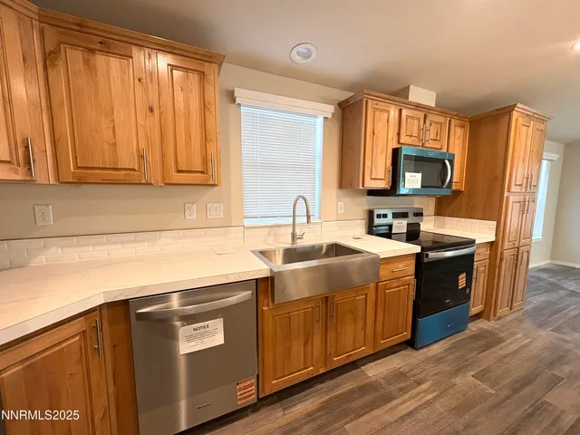 a kitchen with a stove and a sink