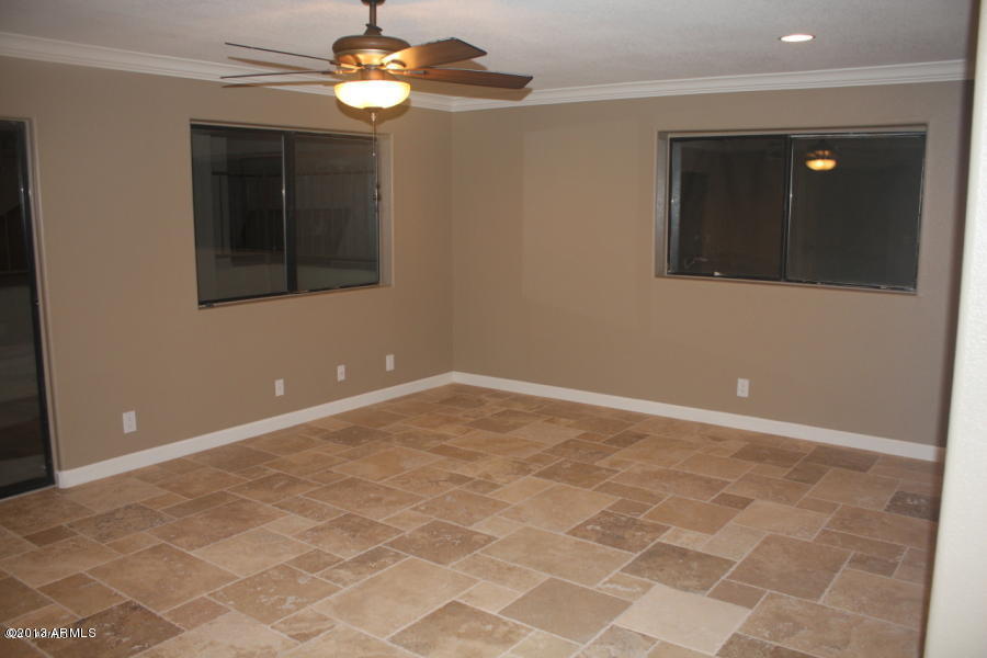 1522 West Del Rio Street Chandler, AZ 85224 - Photo 4 of 11 a view of an empty room with a chandelier fan