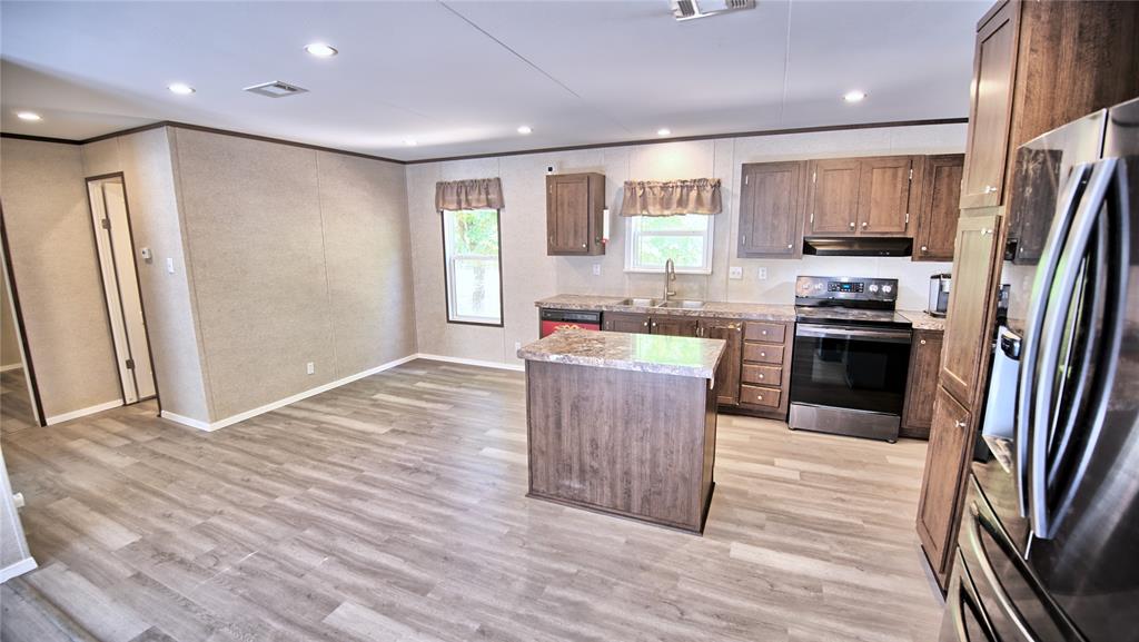 523 Billy Road Bowie, TX 76230 - Photo 12 of 35 kitchen features small island and dining area