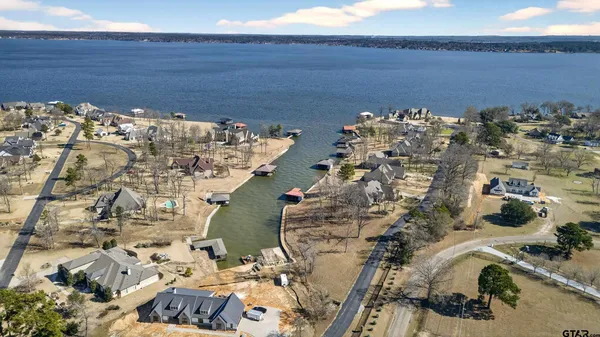 a view of a lake with houses in the background