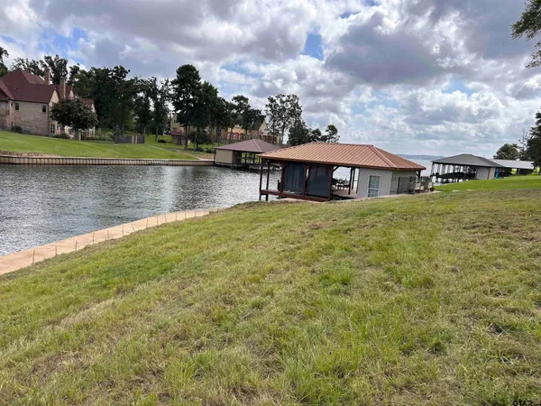 a view of a tree in front of a house