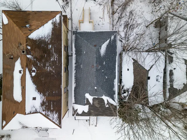 an aerial view of a houses with outdoor space