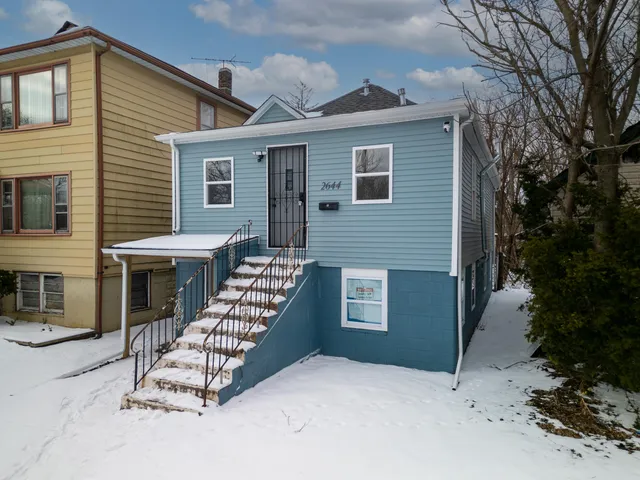 a front view of a house with deck