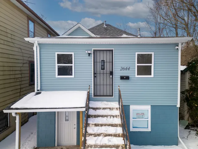 a front view of a house with a garage