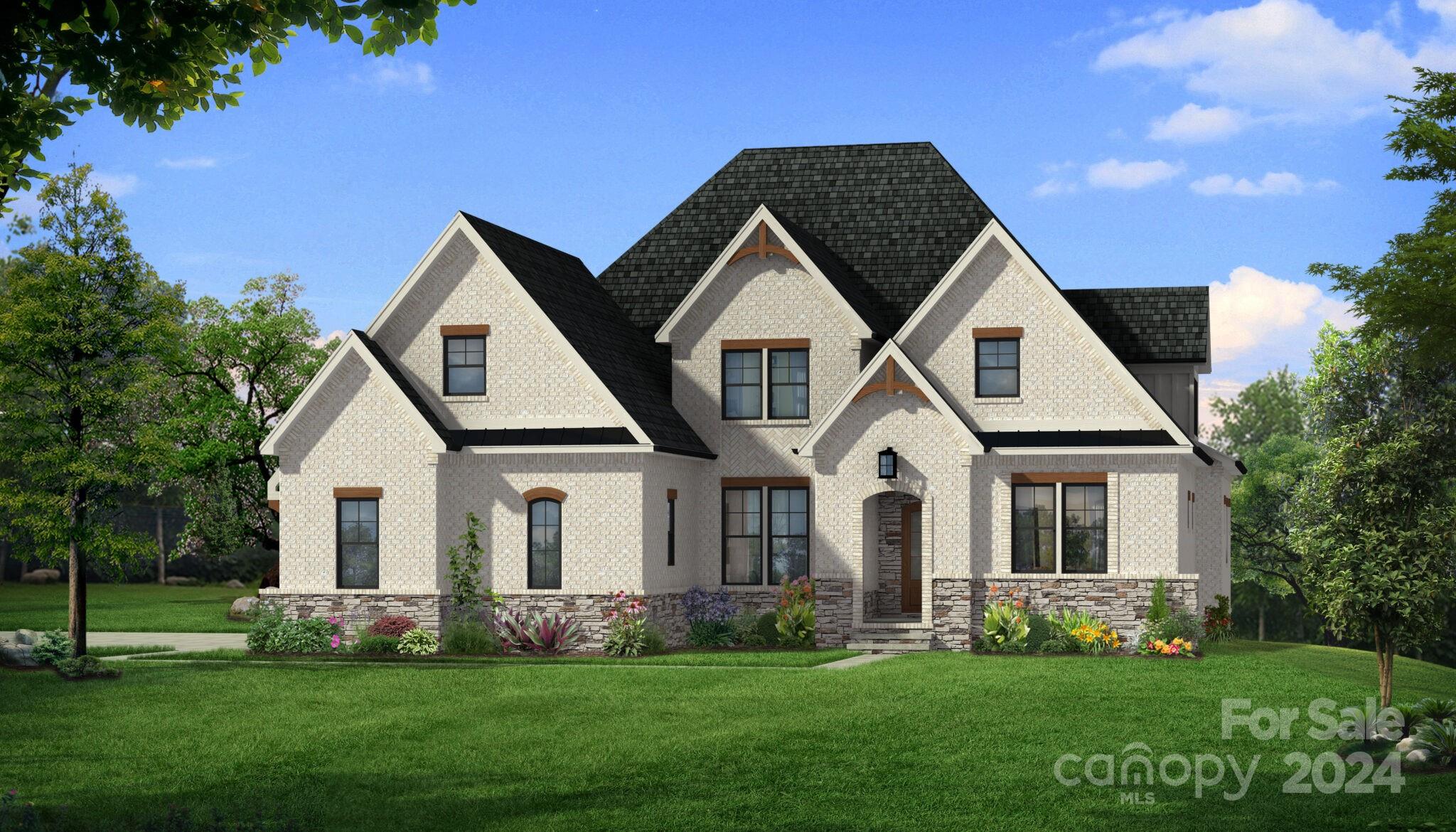 a front view of a house with a garden