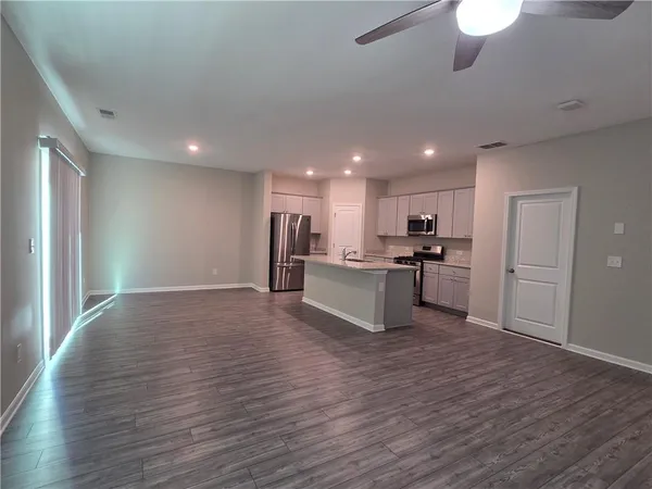 a view of kitchen with wooden floor