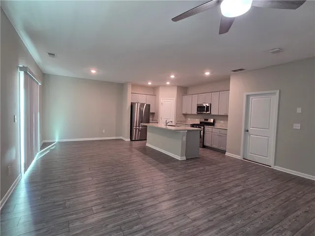 a view of kitchen with wooden floor