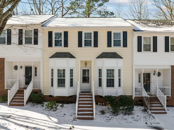 a front view of a house with stairs