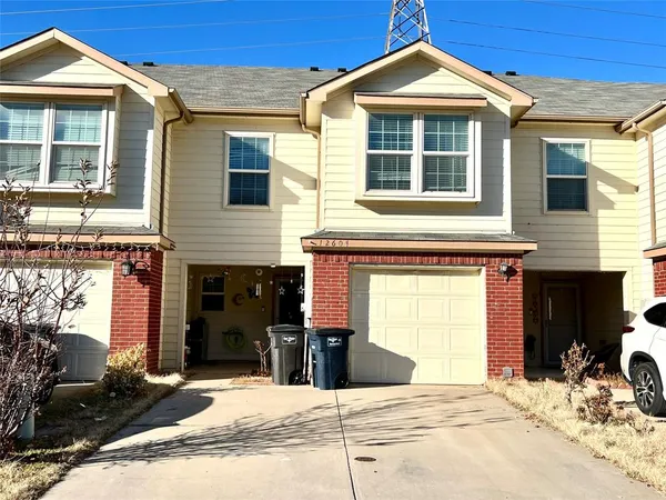 a view of a house with a yard and balcony