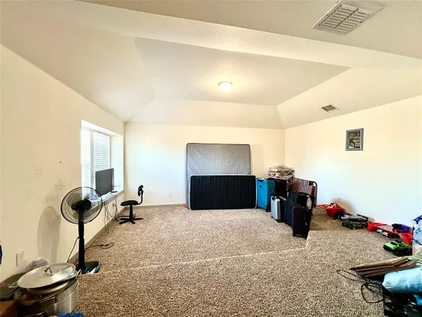 a bedroom with furniture and a bed