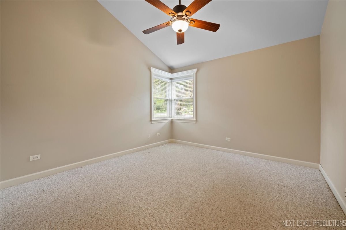 4830 Wolf Road Western Springs, IL 60558 - Photo 30 of 46 an empty room with windows and fan