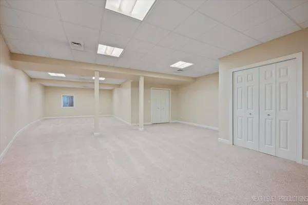 an empty room with a empty space and windows