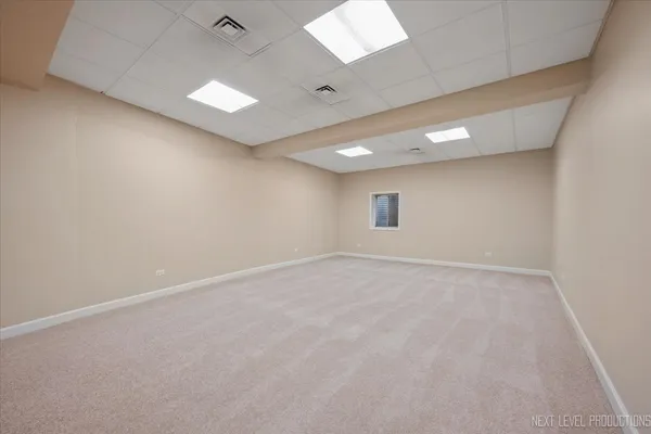 a bedroom with a bed a couch and dresser