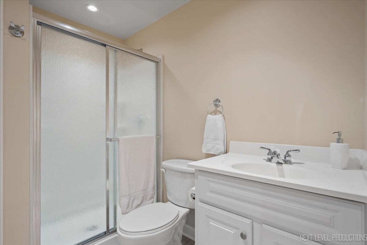 4830 Wolf Road Western Springs, IL 60558 - Photo 36 of 46 a bathroom with a sink a toilet and shower