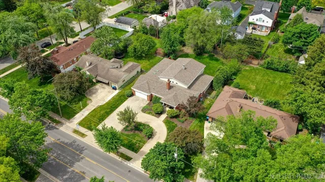 an aerial view of a house with a garden
