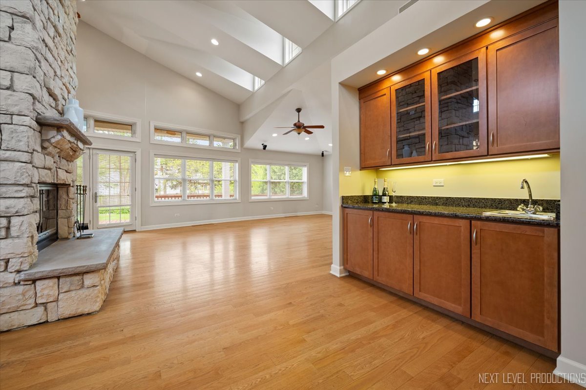 4830 Wolf Road Western Springs, IL 60558 - Photo 5 of 46 a view of an empty room with window and wooden floor