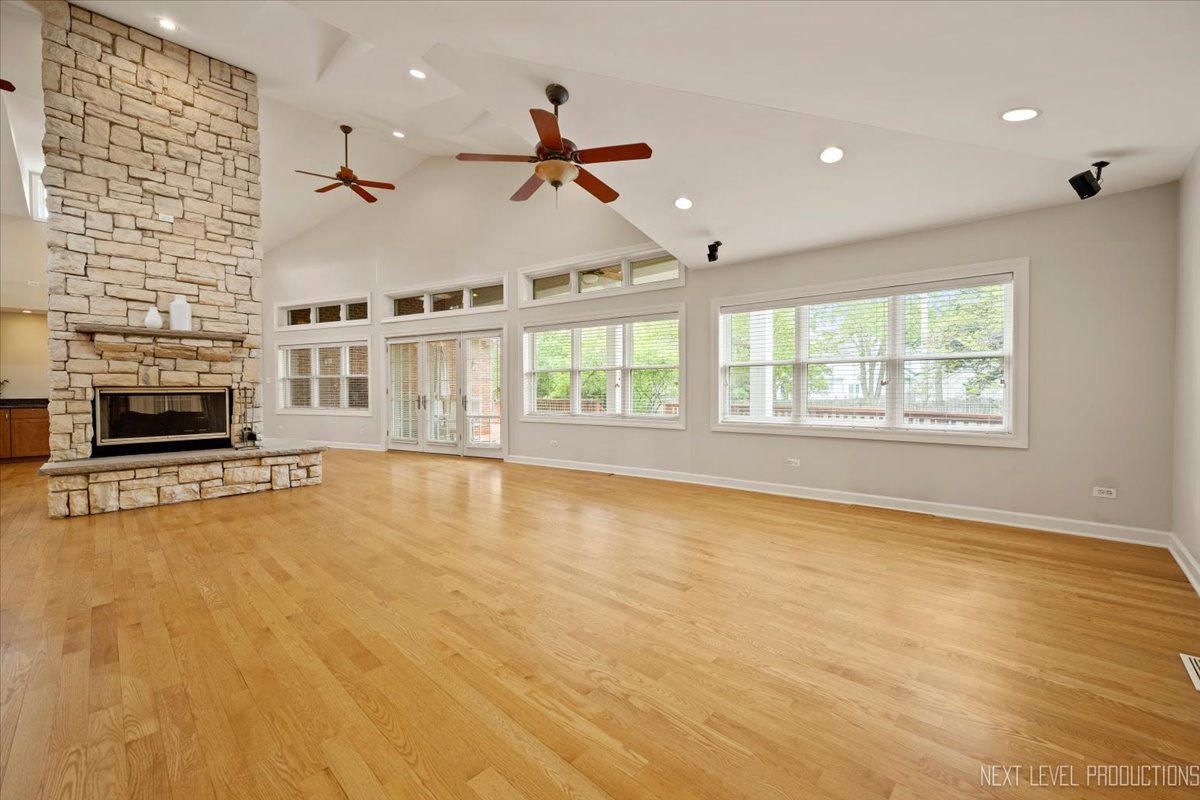 4830 Wolf Road Western Springs, IL 60558 - Photo 10 of 46 an empty room with fireplace and windows