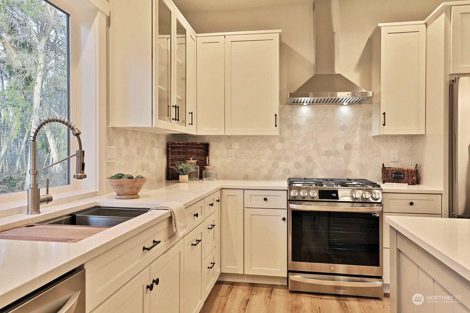 1831 Watkins Road Freeland, WA 98249 - Photo 15 of 37 a kitchen with cabinets appliances a sink and a window
