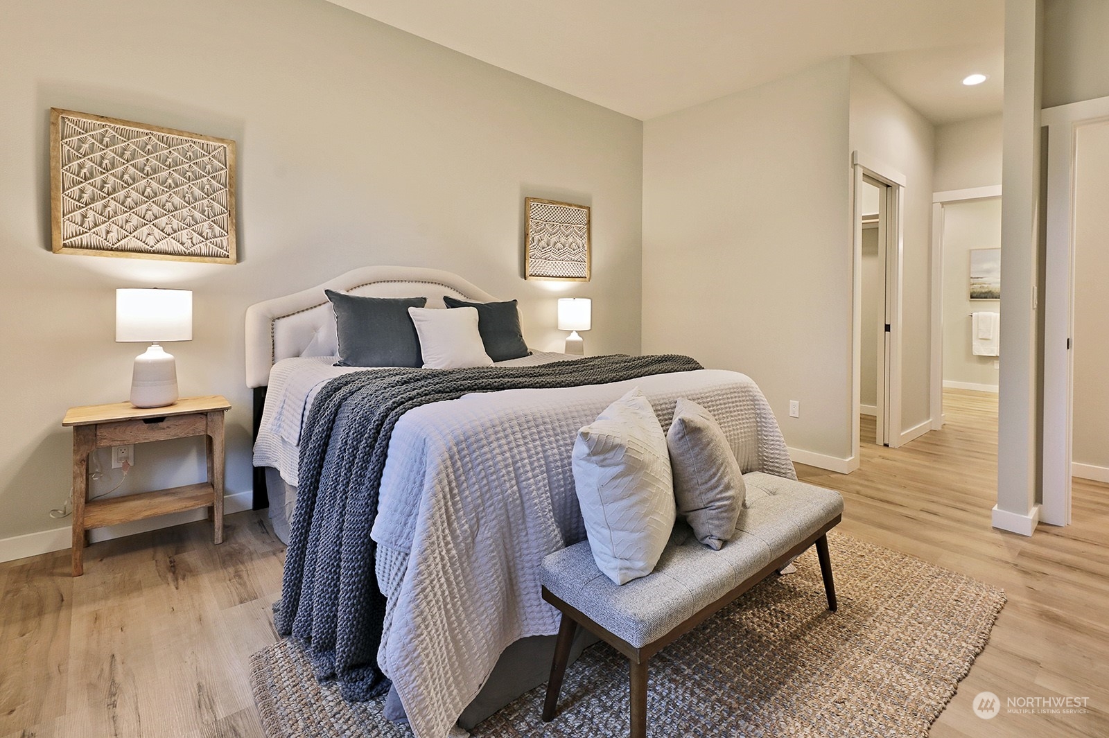 1831 Watkins Road Freeland, WA 98249 - Photo 21 of 37 a spacious bedroom with a bed and wooden floor