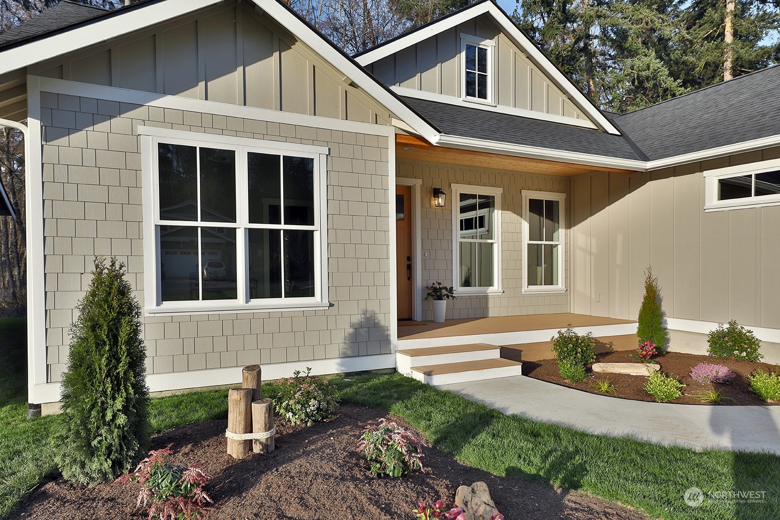 1831 Watkins Road Freeland, WA 98249 - Photo 3 of 37 a front view of a house with garden