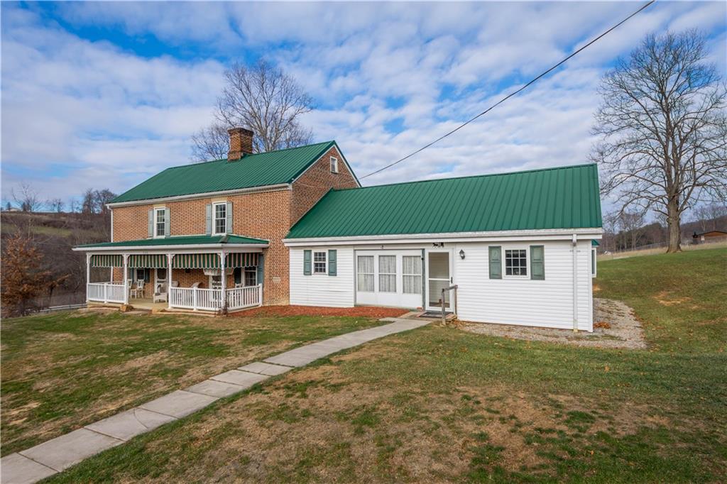 206 South Bridge Road Prosperity, PA 15329 - Photo 3 of 48 a front view of a house with a garden