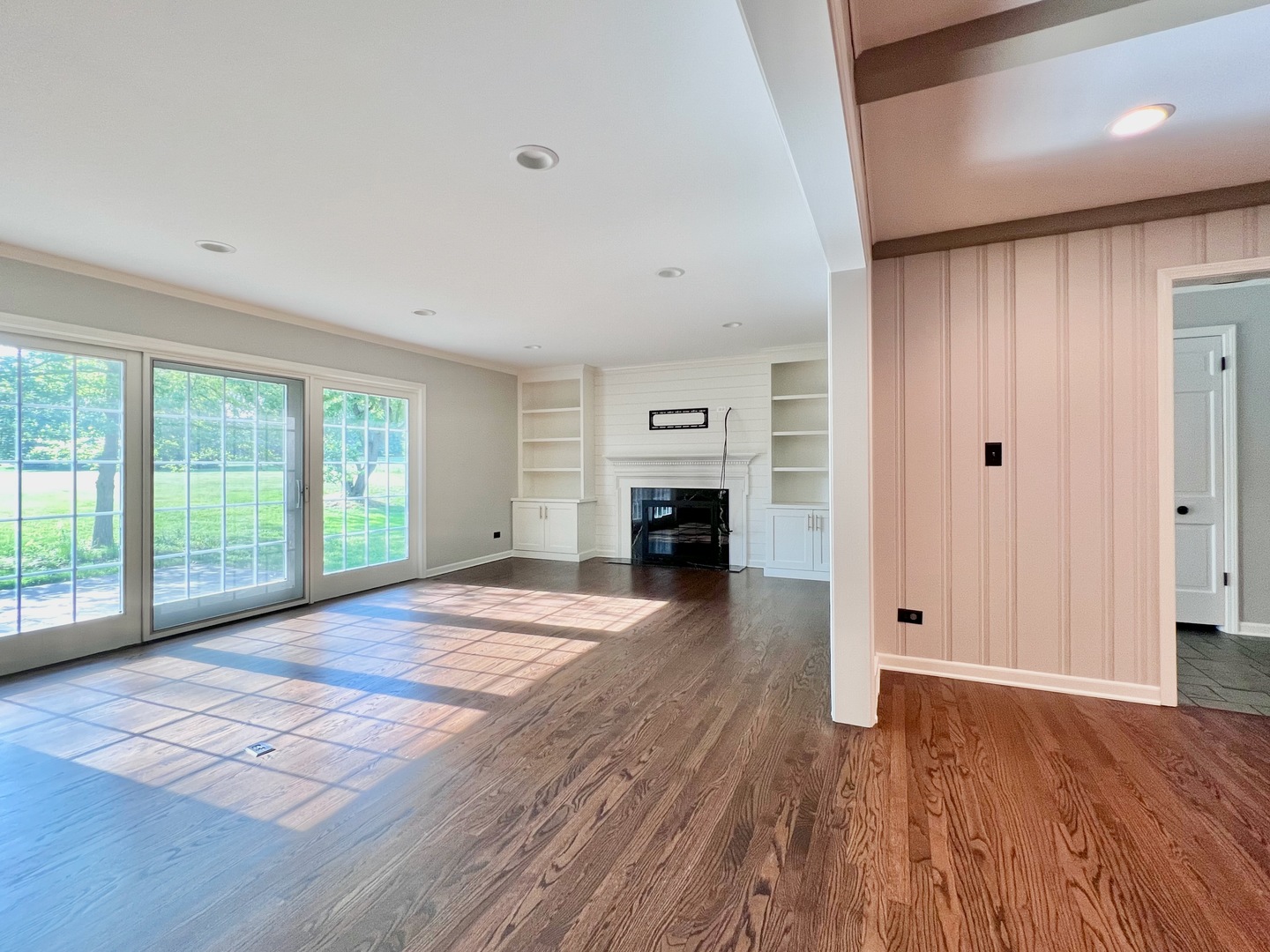 275 Cold Spring Road Barrington, IL 60010 - Photo 11 of 33 a view of empty room with wooden floor and fireplace