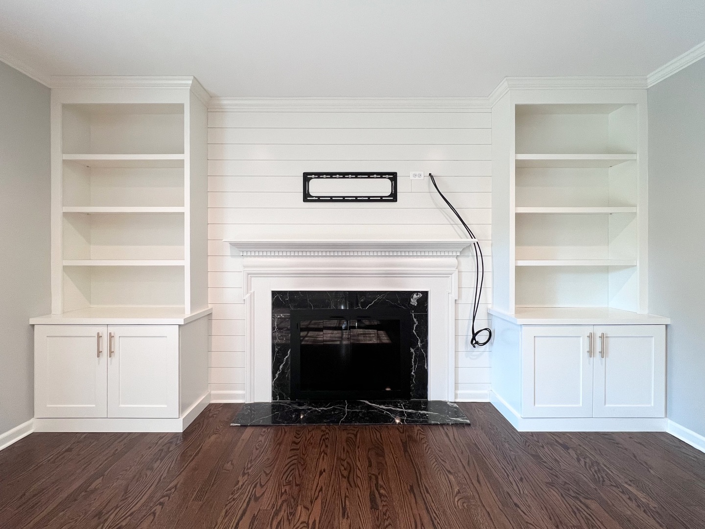 275 Cold Spring Road Barrington, IL 60010 - Photo 12 of 33 a living room with a fireplace and a book shelf