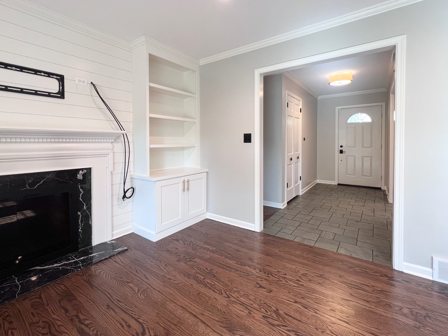 275 Cold Spring Road Barrington, IL 60010 - Photo 13 of 33 a view of a livingroom with wooden floor and a fireplace