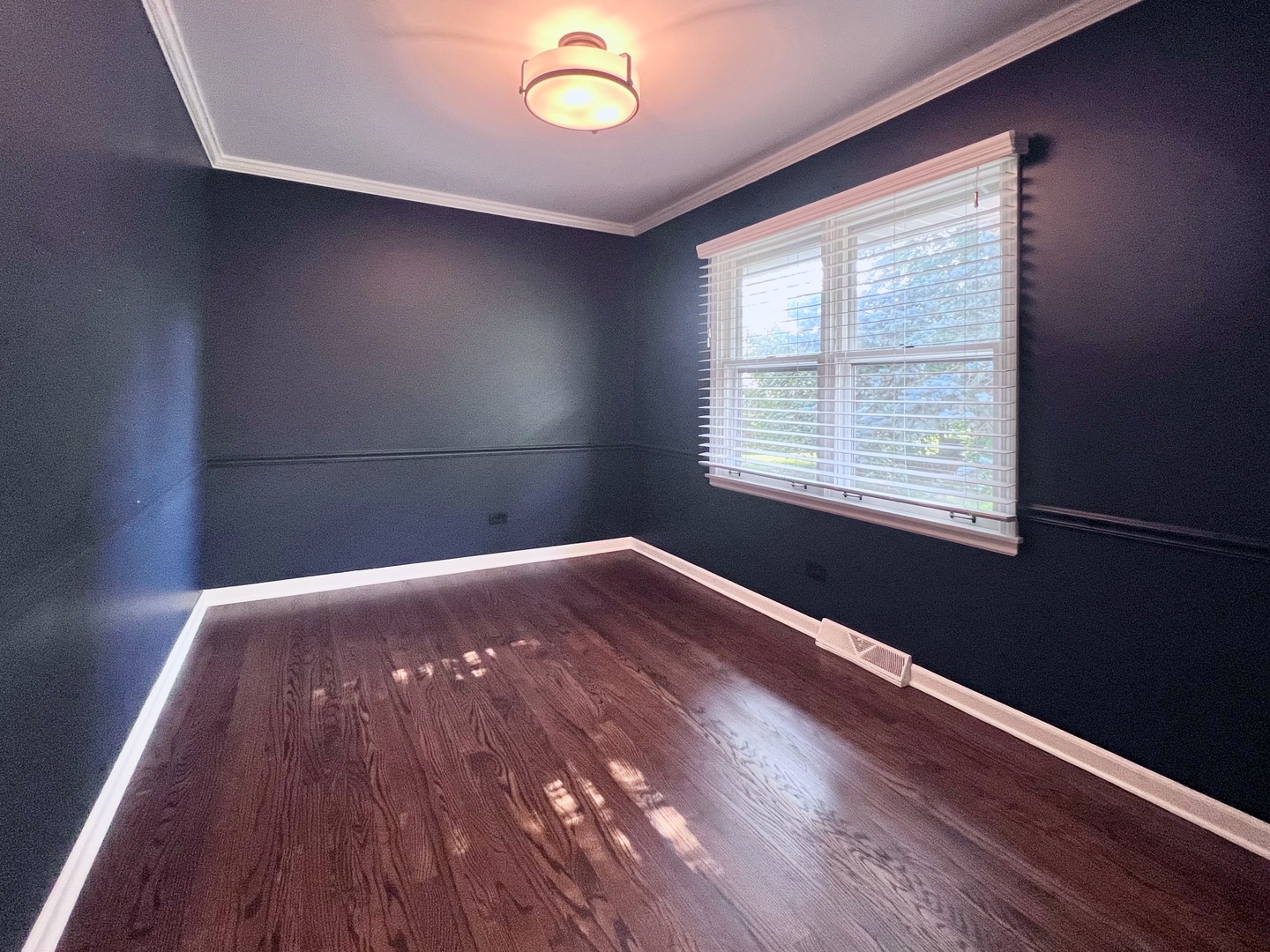 275 Cold Spring Road Barrington, IL 60010 - Photo 14 of 33 a view of an empty room with wooden floor and a window