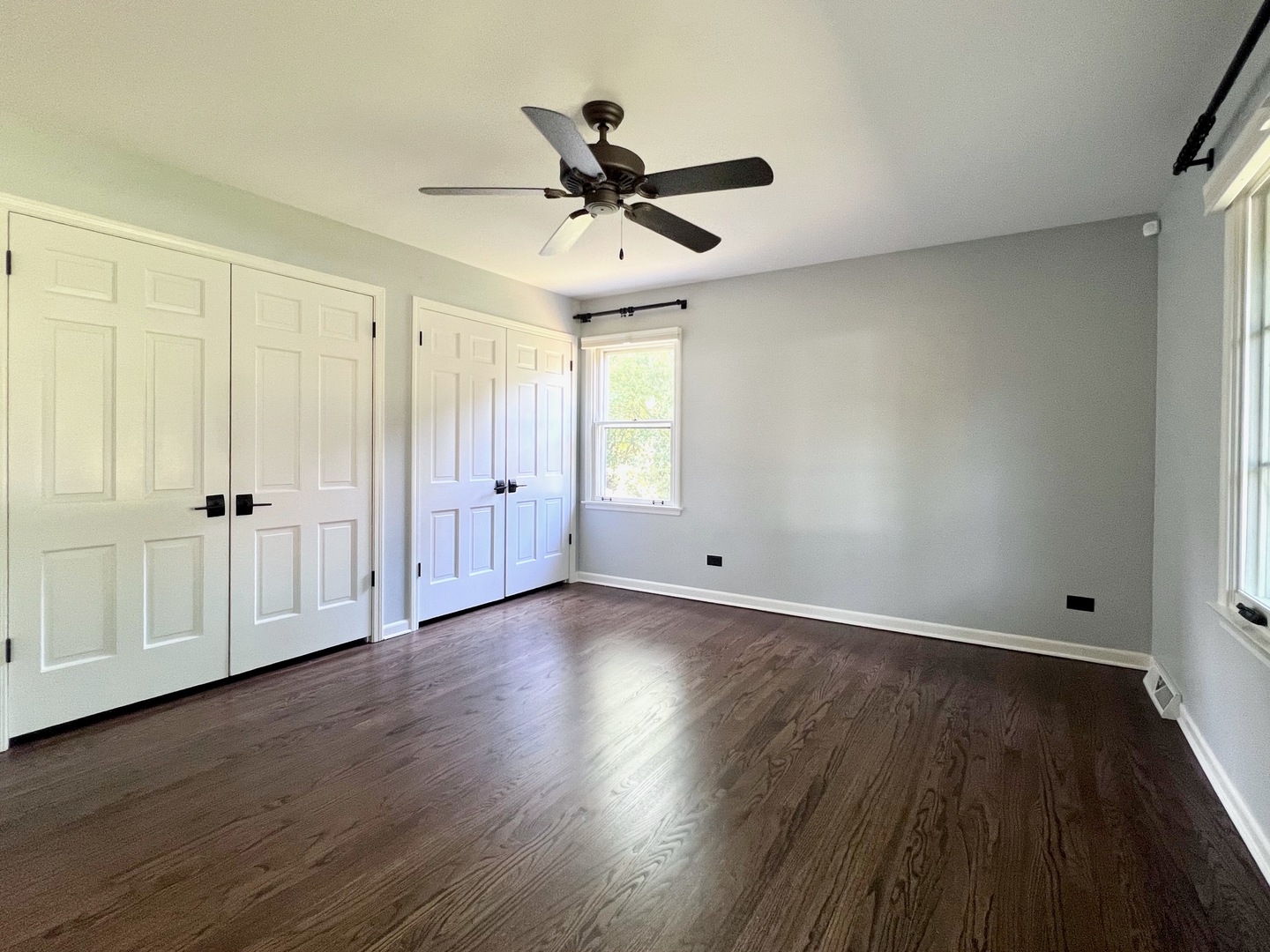 275 Cold Spring Road Barrington, IL 60010 - Photo 17 of 33 an empty room with wooden floor fan and windows