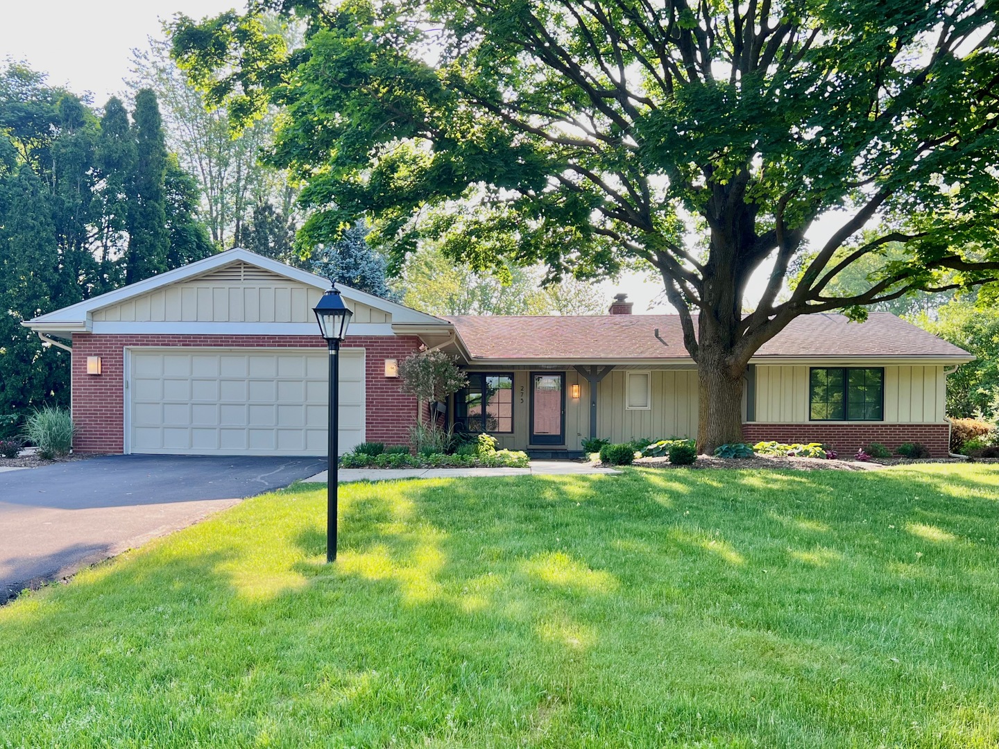 275 Cold Spring Road Barrington, IL 60010 - Photo 33 of 33 a front view of a house with a yard and garage